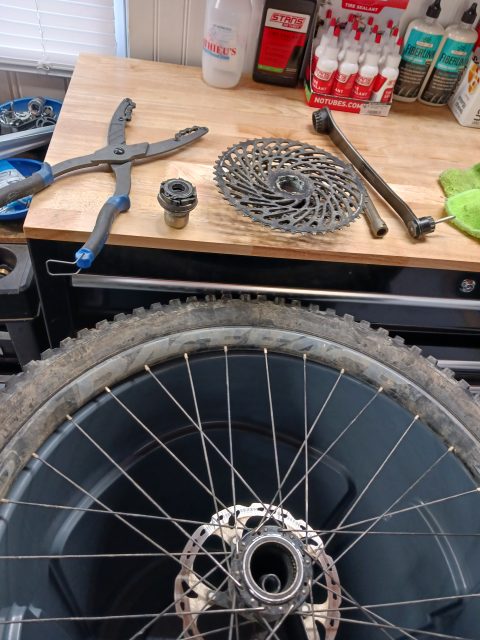 Bicycle wheel being serviced on a repair bench