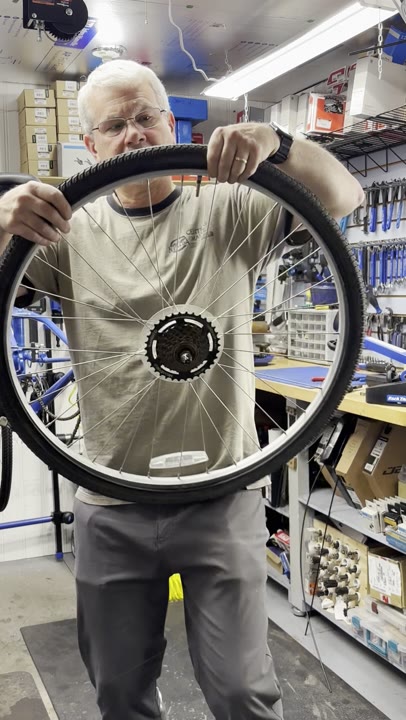 John Waller seating a bicycle tire bead by hand.
