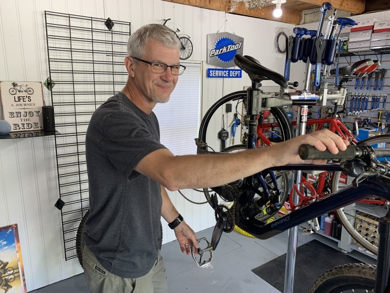 John Waller working in the JW Bicycle Repair shop